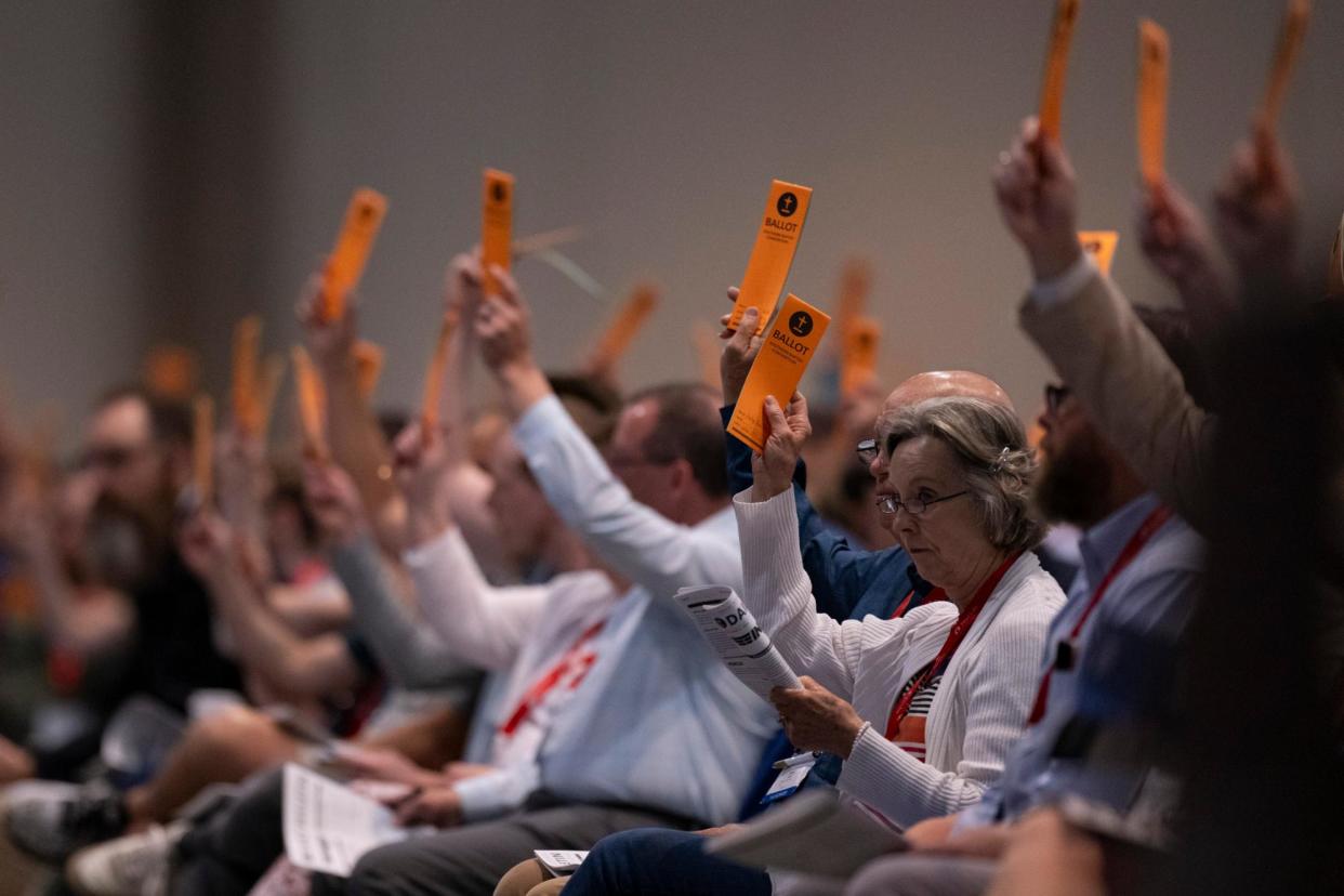 <span>Messengers raise their ballots in support of a resolution put up for vote during a Southern Baptist Convention annual meeting in Indianapolis on Tuesday.</span><span>Photograph: Doug McSchooler/AP</span>