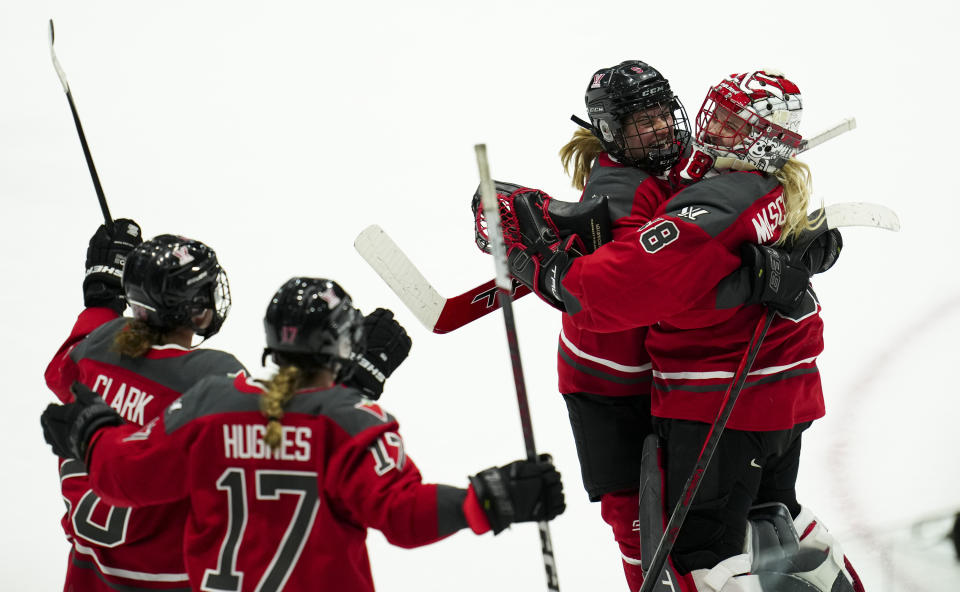 Ottawa goaltender Emerance Maschmeyer (38) celebrates the team's shootout win against Boston with teammate Daryl Watts (9), after a PWHL hockey game Wednesday, April 24, 2024, in Ottawa, Ontario. (Sean Kilpatrick/The Canadian Press via AP)