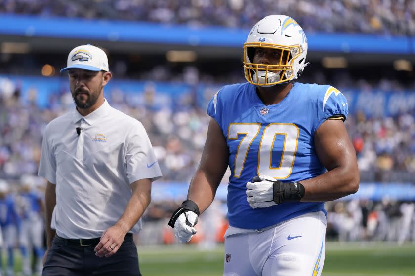 Los Angeles Chargers offensive tackle Rashawn Slater (70) walks.