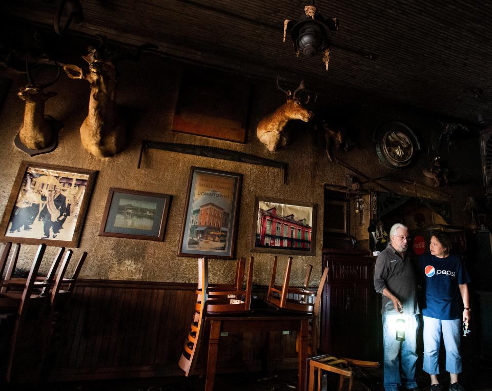 Mickey Thompson, owner of Uncle Mick’s Cajun Cafe  in Prattville, Ala., talks with Cindy Stephens on Friday August 19, 2022, following a Thursday evening fire at the restaurant.