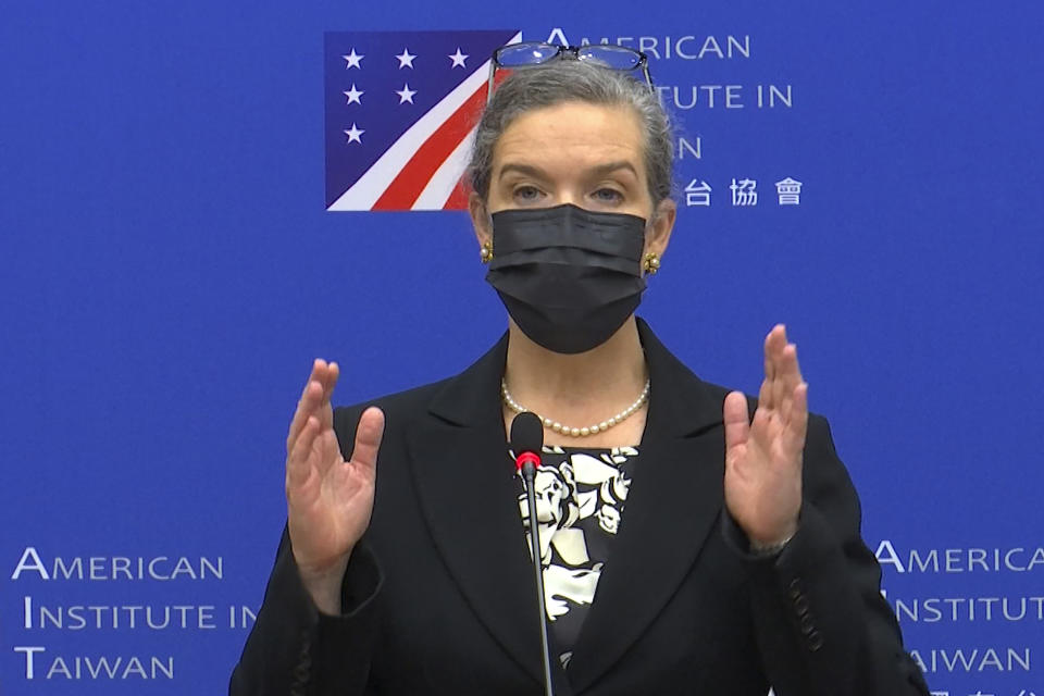 In this image taken from a video footage run by Taiwan's CTS via AP Video, Sandra Oudkirk, the new director of the American Institute in Taiwan, the de facto embassy, speaks during her first public news conference held in Taipei, Taiwan on Friday, Oct. 29, 2021. The U.S. wants to deepen its relationship with Taiwan, the self-ruled island that has become a major point of conflict in the strained U.S.-China relationship, and will work to counter Beijing's "malign" influence, Oudkirk said Friday. (CTS via AP Video)