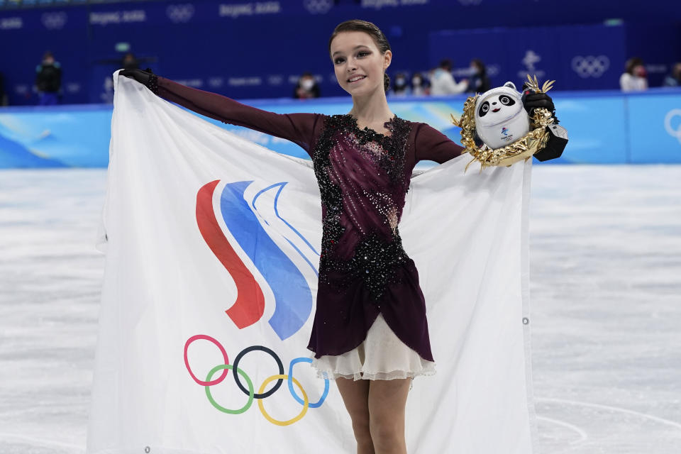 Anna Shcherbakova, of the Russian Olympic Committee, poses for a photo after winning the women's free skate program during the figure skating competition at the 2022 Winter Olympics, Thursday, Feb. 17, 2022, in Beijing. (AP Photo/David J. Phillip)