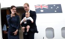 Catherine, the Duchess of Cambridge, waves beside her husband Britain's Prince William with their son Prince George as they depart Wellington on an Australian air force jet, April 16, 2014. Britain's Prince William and his wife Kate are undertaking a 19-day official visit to New Zealand and Australia. REUTERS/Anthony Phelps (NEW ZEALAND - Tags: ROYALS ENTERTAINMENT POLITICS)