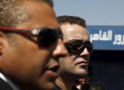 Al Jazeera television journalists Mohamed Fahmy (L) and Baher Mohamed talk to the media outside Tora prison, in Cairo, Egypt, July 30, 2015. REUTERS/Asmaa Waguih