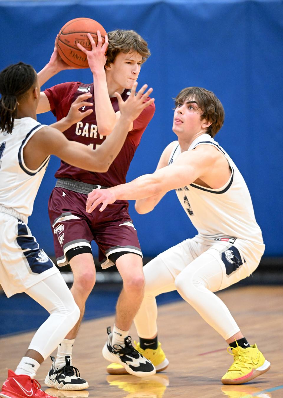In this March 2022 photo, Charlie Condon of Carver is pressured by Jaeden Greenleaf and Tamarr Washington of Cape Cod Academy in the MIAA Div. 4 round of 32 basketball game.
(Photo: Ron Schloerb/Cape Cod Times)