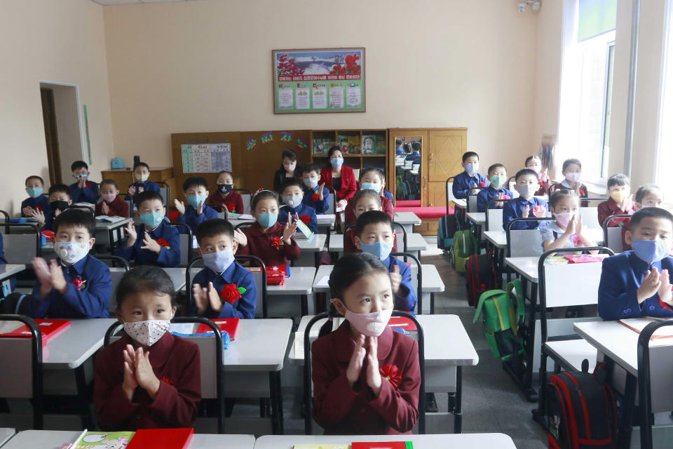 FILE - Students wearing face masks take a class at Kim Song Ju Primary School in Pyongyang, North Korea, on June 3, 2020. North Korea is putting surveillance cameras in schools and workplaces, and collecting fingerprints, photographs and other biometric information from its citizens in a technology-driven push to monitor its population even more closely, a report said Tuesday, April 16, 2024. (AP Photo/Cha Song Ho, File)