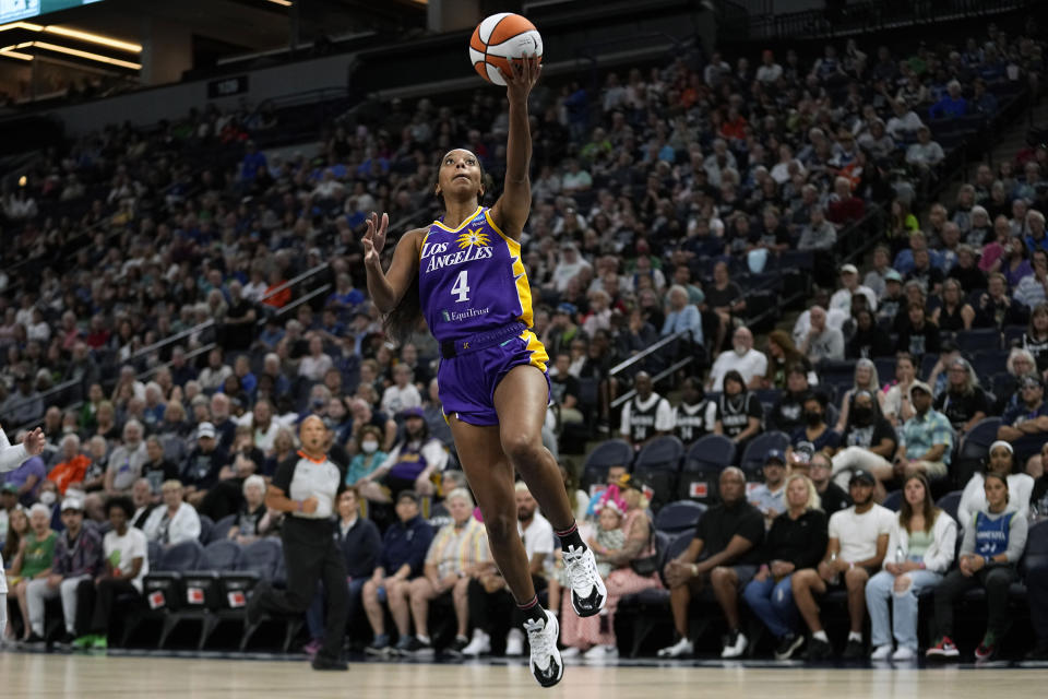 Los Angeles Sparks guard Lexie Brown (4) goes up to shoot during the first half of a WNBA basketball game against the Minnesota Lynx, Sunday, June 11, 2023, in Minneapolis. (AP Photo/Abbie Parr)