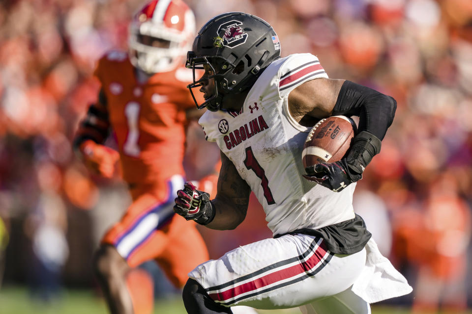 FILE - South Carolina running back MarShawn Lloyd (1) runs with the ball during an NCAA college football game against Clemson on Saturday, Nov. 26, 2022, in Clemson, S.C. South Carolina coach Shane Beamer lost some key contributors from the Gamecocks' eight-win team to the transfer portal this offseason including leading rusher MarShawn Lloyd to Southern California. (AP Photo/Jacob Kupferman, File)