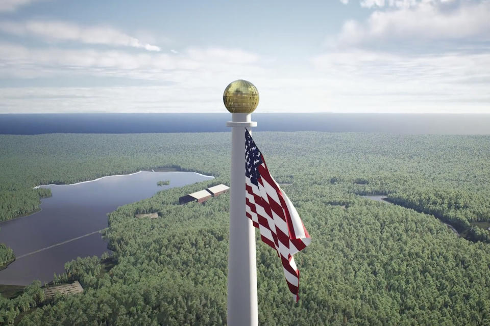 This image from video provided by the Flagpole of Freedom Park in 2022 shows a rendering of a proposed world's tallest flagpole in Maine. The 10,000-acre plot is in a township overseen by a state agency, neighboring Columbia Falls. (Flagpole of Freedom Park via AP)