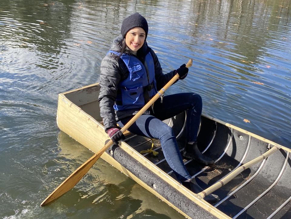 someone wearing the puffer jacket in a boat