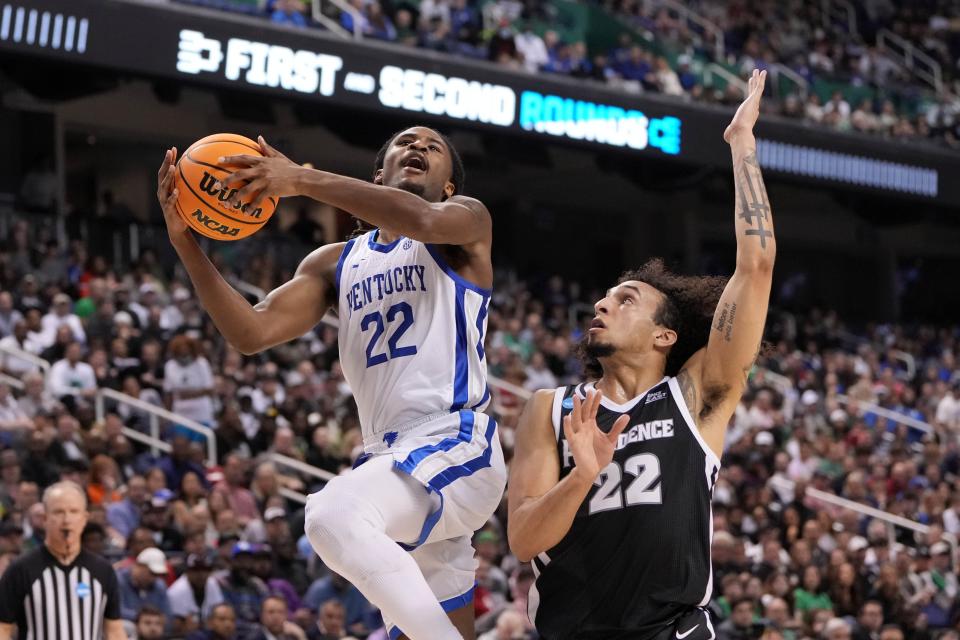 Mar 17, 2023; Greensboro, NC, USA;  Kentucky Wildcats guard Cason Wallace (22) shoots against Providence Friars guard Devin Carter (22) in the second half at Greensboro Coliseum. Mandatory Credit: Bob Donnan-USA TODAY Sports