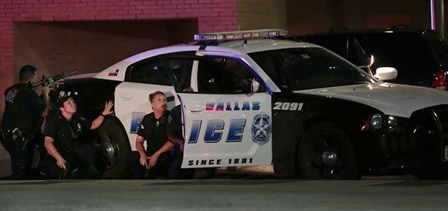 Dallas police responding after shots were fired during the protest. Photo: Maria R. Olivas/The Dallas Morning News via AP