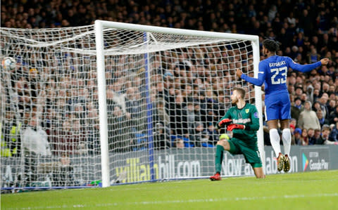 Chelsea's Michy Batshuayi, right, scores - Credit: AP