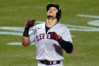 Cleveland Indians' Cesar Hernandez crosses home plate after hitting a grand slam off Pittsburgh Pirates relief pitcher Sam Howard during the seventh inning of a baseball game in Pittsburgh, Friday, June 18, 2021. (AP Photo/Gene J. Puskar)