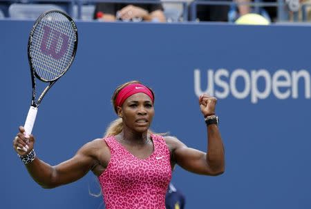 Serena Williams of the U.S. celebrates a point against Kaia Kanepi of Estonia during their match at the 2014 U.S. Open tennis tournament in New York, September 1, 2014. REUTERS/Ray Stubblebine