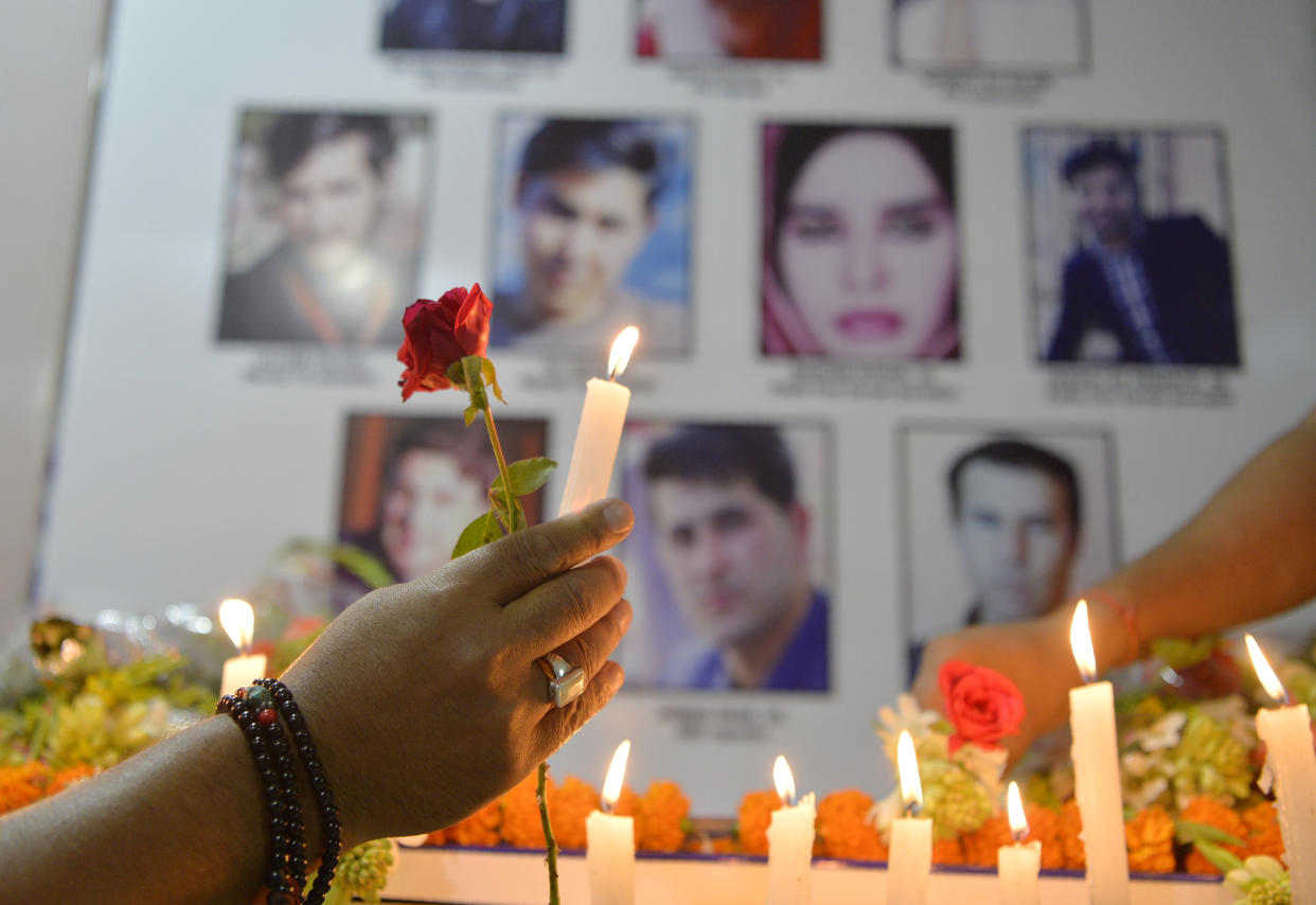 Indian journalists light candles during a vigil for ten Afghan journalists during an event to mark World Press Freedom Day in Siliguri, India, on May 3, 2018. The journalists were killed in a targeted suicide bombing. (Photo: Diptendu Dutta/AFP/Getty Images)