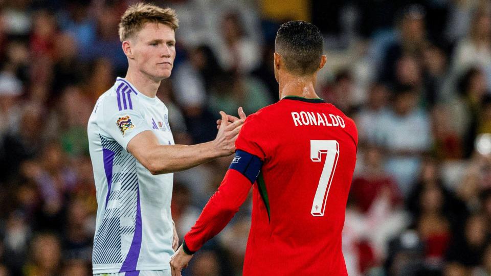 Scotland's Scott McTominay (L) and Portugal's Cristiano Ronaldo shake hands during a UEFA Nations League match between Portugal and Scotland at the Estadio da Luz,