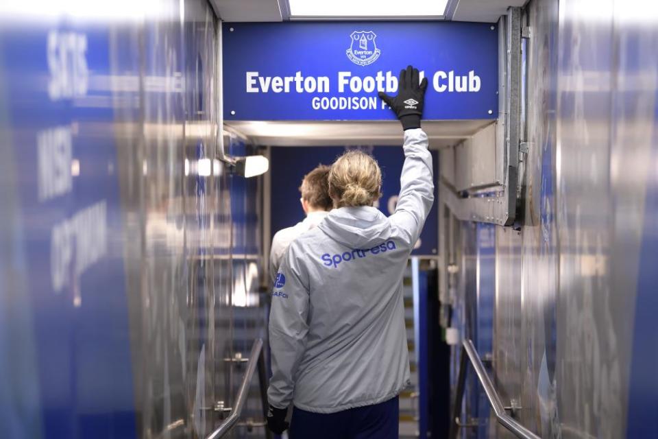 Everton’s Tom Davies touches the club crest in the Goodison Park tunnel before the Premier League match against Burnley in December 2019.