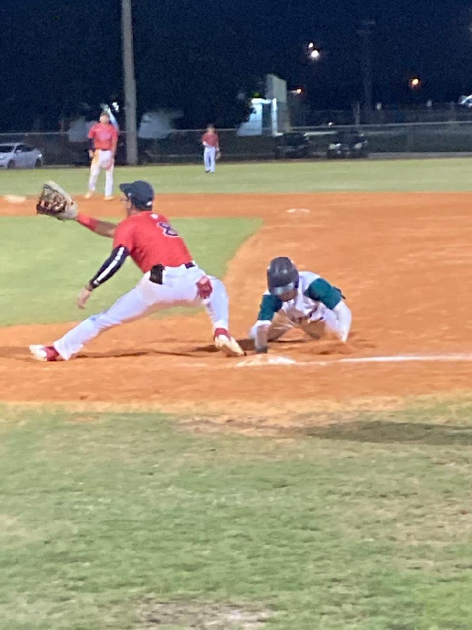 Jupiter Christian's James Weisman attempts a pickoff during a win over Boca Raton Christian on May 2, 2023.