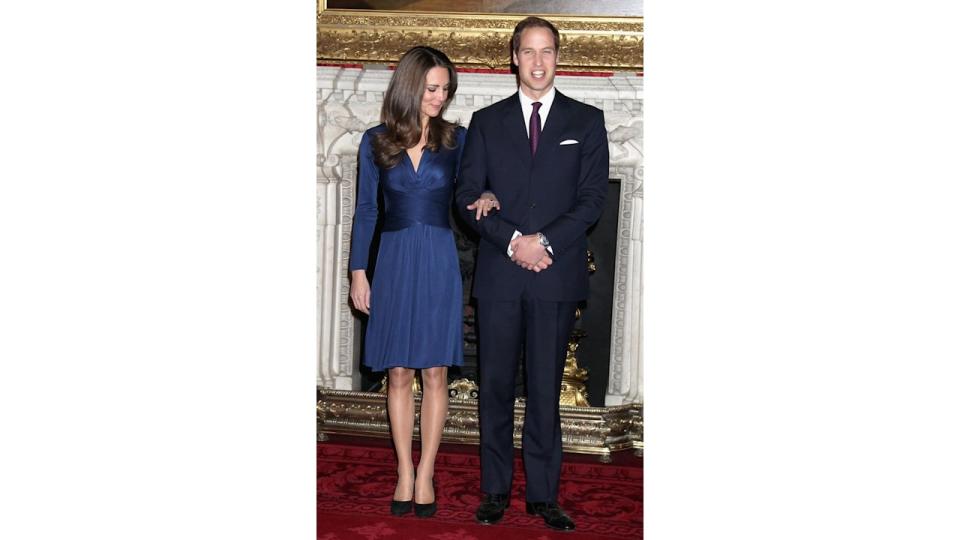 Kate pictured admiring her engagement ring during her and Prince William's engagement announcement