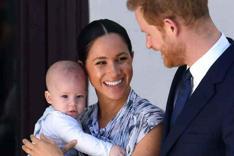 Prince Harry, Duke of Sussex, Meghan, Duchess of Sussex and their son Archie Mountbatten-Windsor as a baby during a royal visit