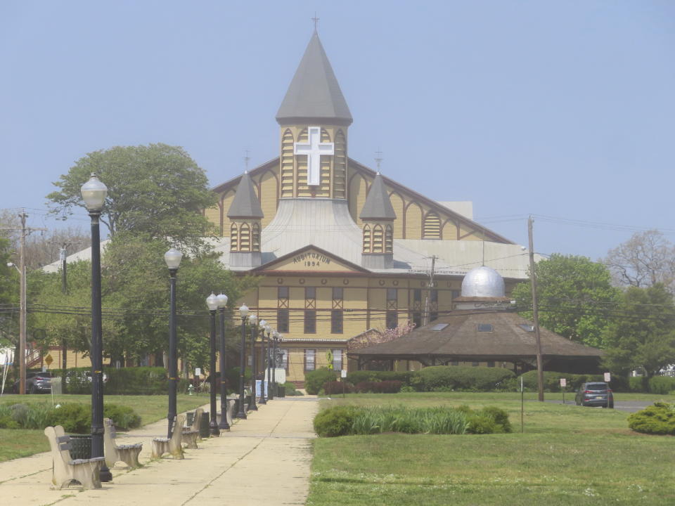 Haze slowly burns away from the Great Auditorium in Ocean Grove, N.J. on May 2, 2024. The state of New Jersey says the Ocean Grove Camp Meeting Association is violating state beach access laws by keeping people off the beach until noon on Sundays. (AP Photo/Wayne Parry)