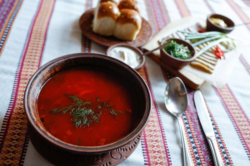 A bowl with Ukrainian dish borshch is seen on a table of a traditional cuisine restaurant in Kyiv