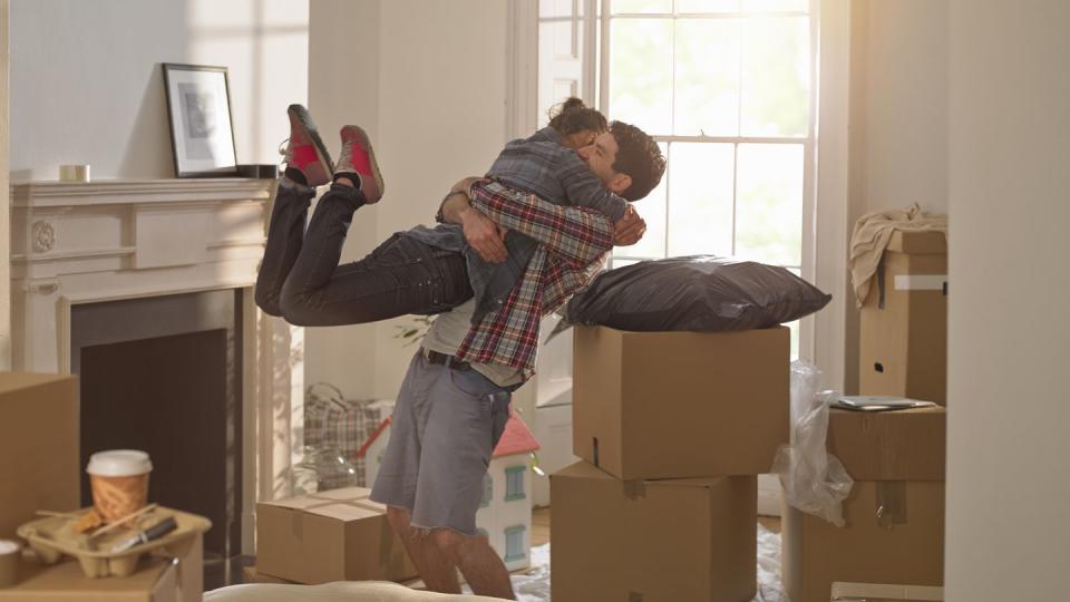 a couple celebrating moving in to a new home