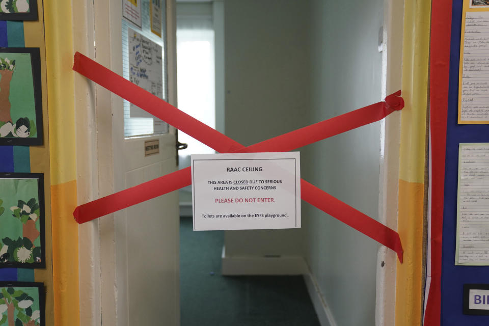 A taped off section inside Parks Primary School which has been affected with sub standard reinforced autoclaved aerated concrete (Raac), in Leicester, England, Friday, Sept. 1, 2023. The British government has ordered more than 100 schools to keep some or all of their buildings closed when the new academic year begins next week because of concern crumbling concrete threatens the safety of children and staff. The announcement, which came late on Thursday sent school administrators scrambling to find ways to accommodate pupils, with some expected to return to the online instruction used during the COVID-19 pandemic. (Jacob King/PA via AP)