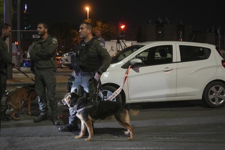 Israeli police secure the site of a shooting attack near a synagogue in Jerusalem, Friday, Jan. 27, 2023. A Palestinian gunman opened fire outside an east Jerusalem synagogue Friday night, killing seven people, including a 70-year-old woman, and wounding three others before police shot and killed him, officials said. It was the deadliest attack on Israelis in years and raised the likelihood of further bloodshed. (AP Photo/Maya Alleruzzo)