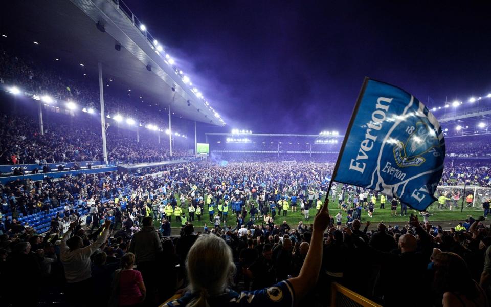 Everton's fans invade the football pitch to celebrate