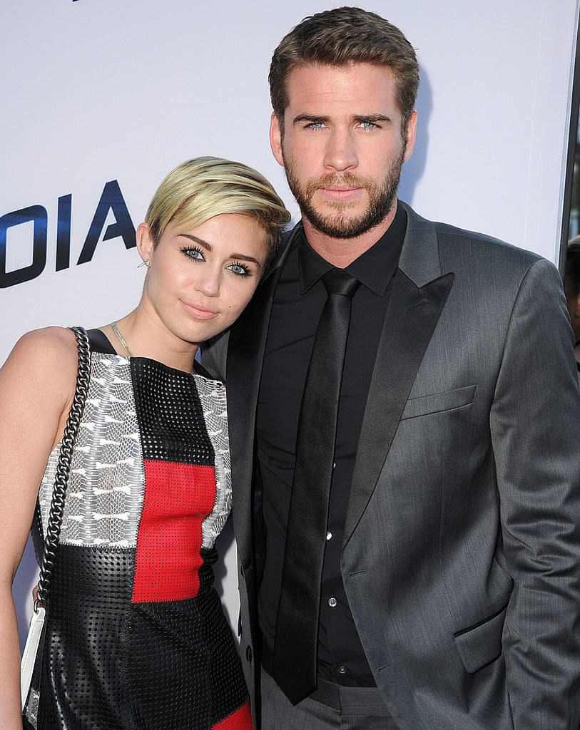 Miley resting her head on Liam's shoulder