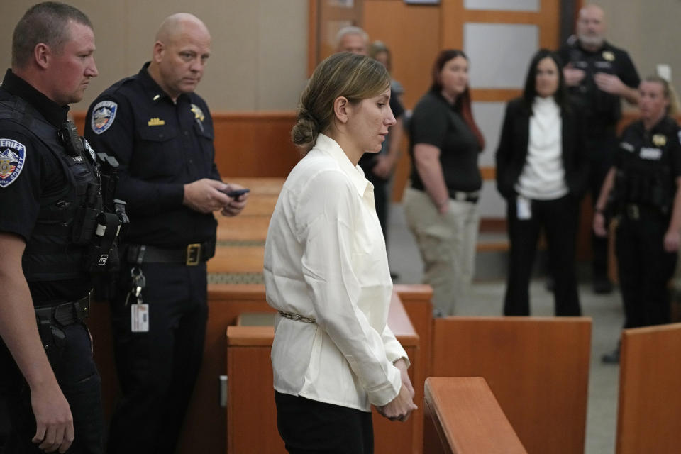 Kouri Richins, a Utah mother of three who authorities say fatally poisoned her husband then wrote a children's book about grieving, returns to the courtroom following a recess during a bail hearing Monday, June 12, 2023, in Park City, Utah. A judge ruled to keep her in custody for the duration of her trial. (AP Photo/Rick Bowmer, Pool)