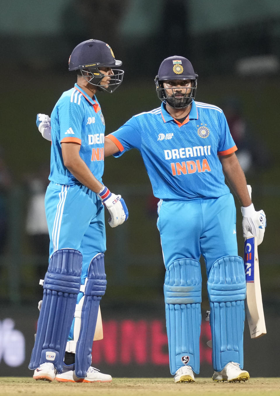 India's Rohit Sharma, right, congratulates Shubman Gill for scoring a half century during the Asia Cup cricket match between India and Nepal in Pallekele, Sri Lanka on Monday, Sep. 4. (AP Photo/Eranga Jayawardena)