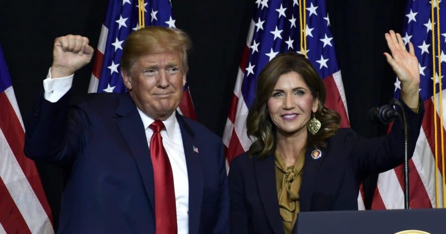 In this Sept. 7, 2018 file photo President Donald Trump appears with Gov. Kristi Noem in Sioux Falls, S.D. South Dakota officials said Wednesday, Aug. 12, 2020, they plan to erect a security fence budgeted around the official governor’s residence to protect Noem. Noem's office did not give specifics on any threats. The South Dakota Republican has championed a hands-off approach to managing the coronavirus crisis and also raised her national political profile in the past year, including tying herself more closely to Trump. (AP Photo/Susan Walsh, File)