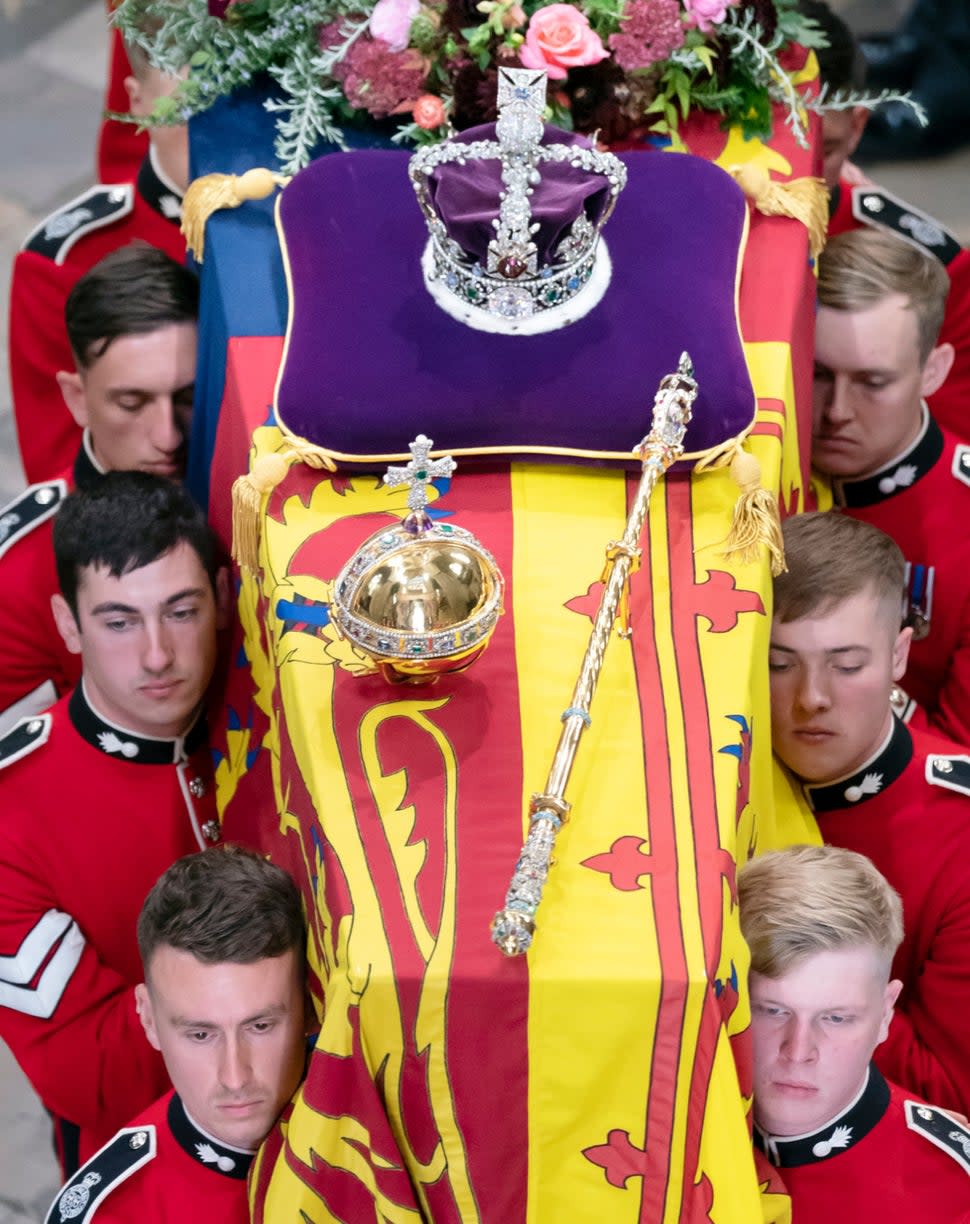 queen elizabeth ii's coffin with crown sceptre and orb