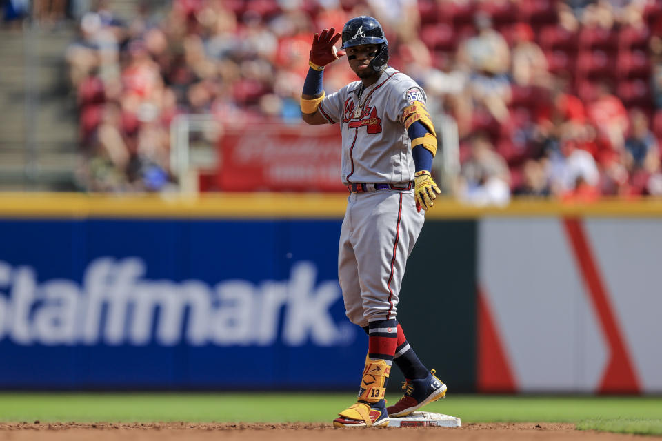 Atlanta Braves' Ronald Acuna Jr. reacts after hitting a double during the third inning of a baseball game against the Cincinnati Reds in Cincinnati, Saturday, June 26, 2021. (AP Photo/Aaron Doster)