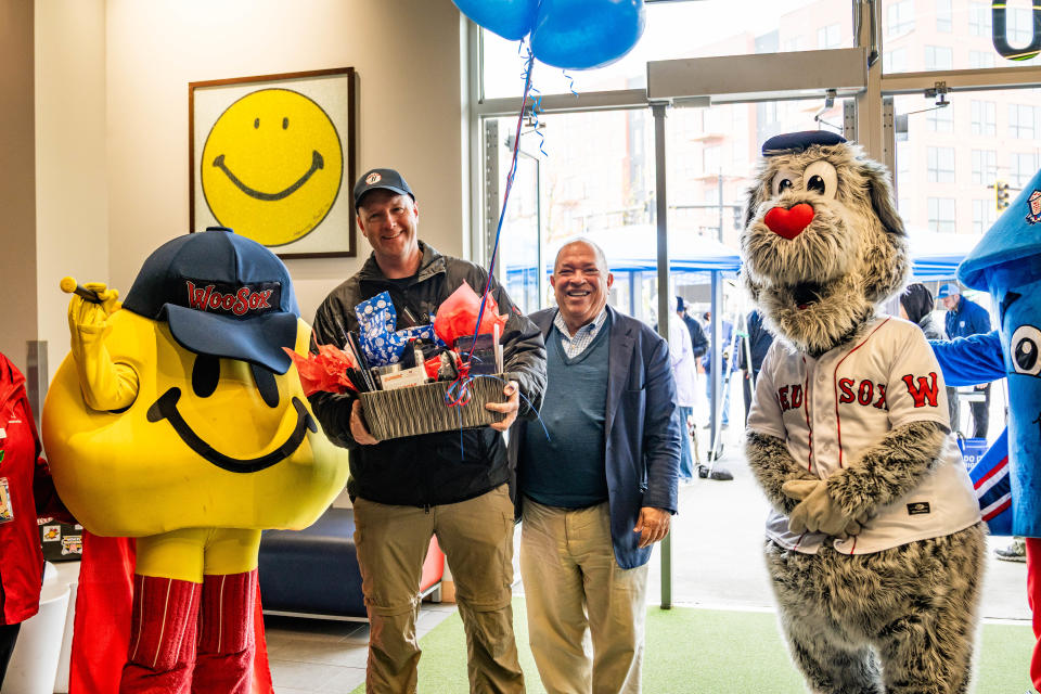 WooSox President Dr. Charles Steinberg, second from right, presented the One Millionth Fan in WooSox history to Hubbardston's Matt Gingras, second from right. Gingras received a prize package of WooSox goodies that were presented by WooSox mascots Smiley Ball and Woofster.