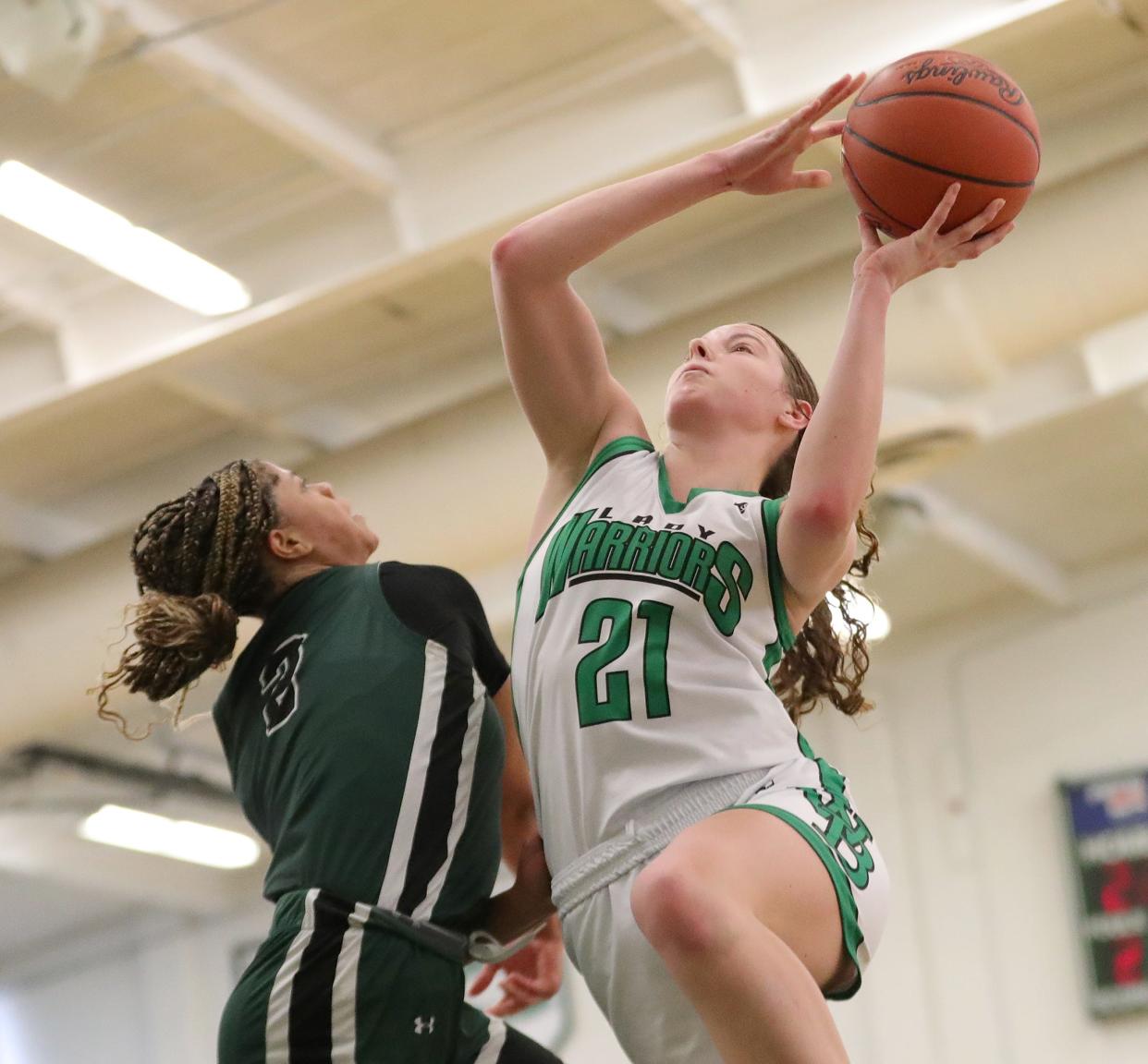 West Branch's Sophia Gregory puts up a shot defended by Laurel's Saniyah Hall in a Division II district final, Saturday, March 2, 2024, at Nordonia High School.