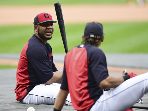 Cleveland Indians’ Edwin Encarnacion, left, talks with Erik Gonzalez during a team workout, Tuesday, Oct. 10, 2017, in Cleveland. The Indians will play the New York Yankees Wednesday in Game 5 of the ALDS. (AP Photo/David Dermer)