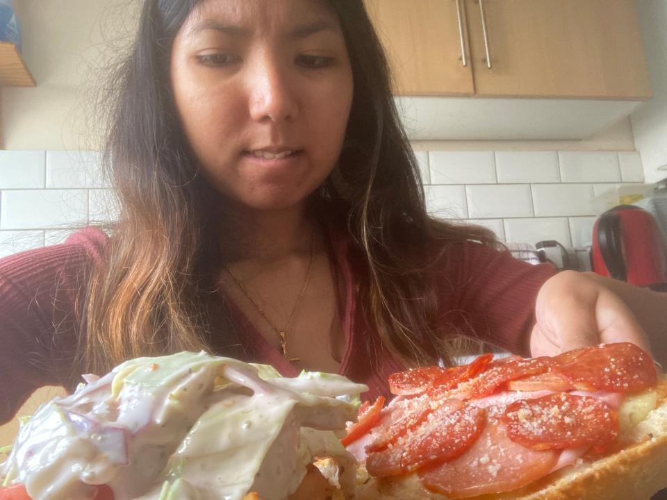 A picture of the author folding up the bread, with a worried look.