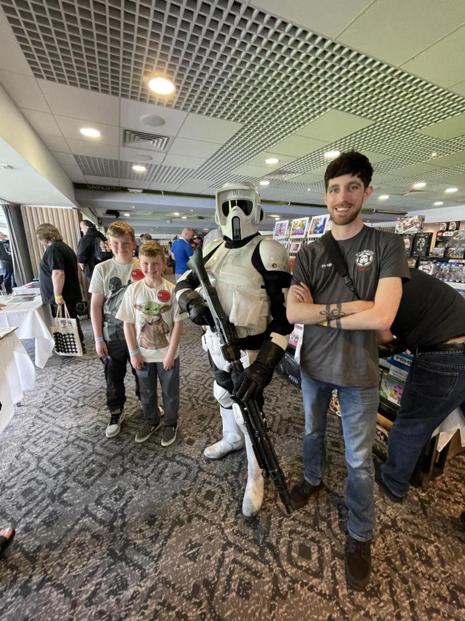 Lancashire Telegraph: John Ashton from Burnley of the Imperial Alliance as a Biker Scout Trooper, with Jack Walsh, 28, from Clayton-le-Moors, a member of the 5th Legion, and Freddie, 11, and George Copland, 8, from Haworth