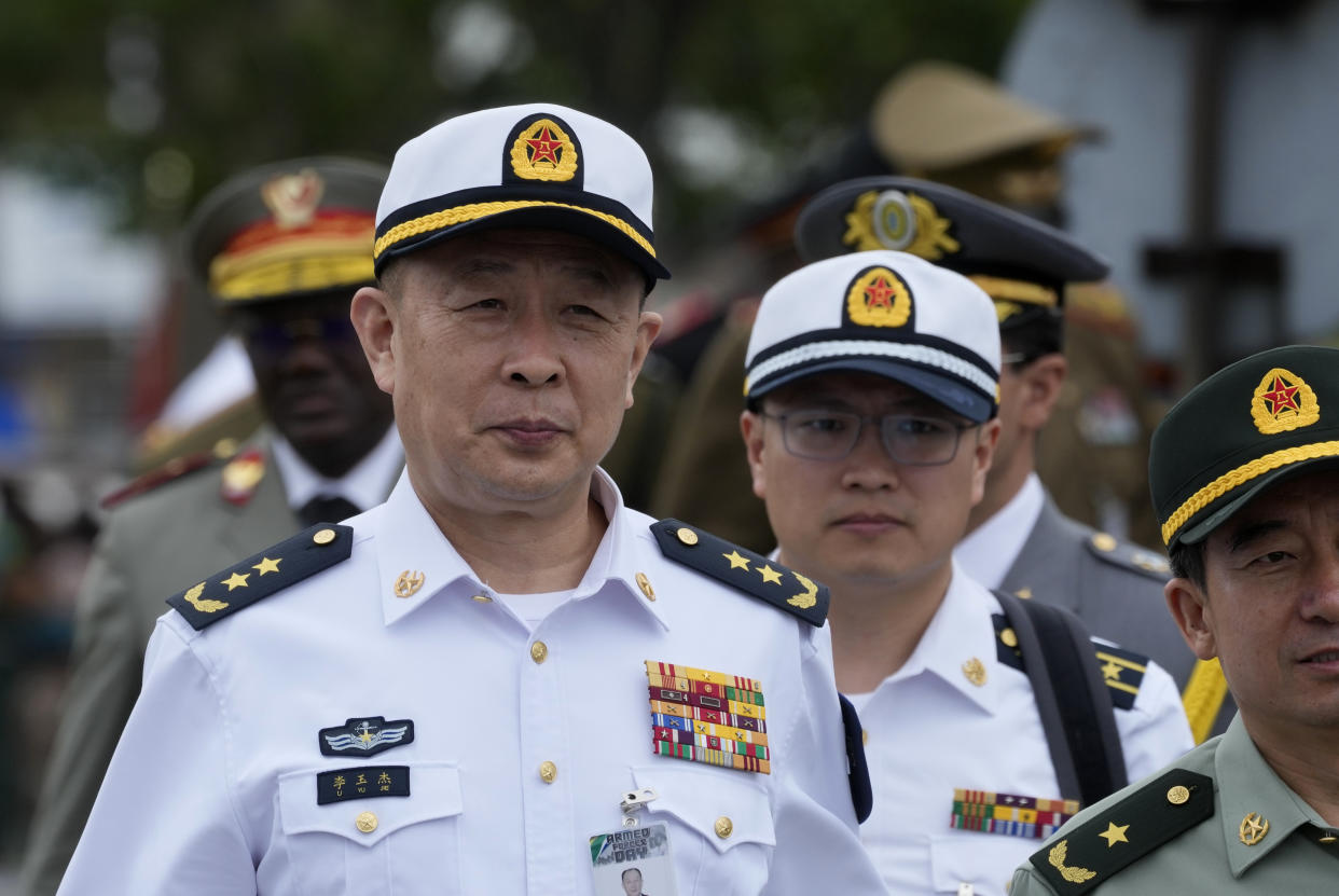 Chinese navy officials attend the Armed Forces Day in Richards Bay, South Africa, Tuesday, Feb. 21, 2023. The parade took place as a naval exercise was underway off the east coast of the country with Russian and Chinese navies. (AP Photo/Themba Hadebe)