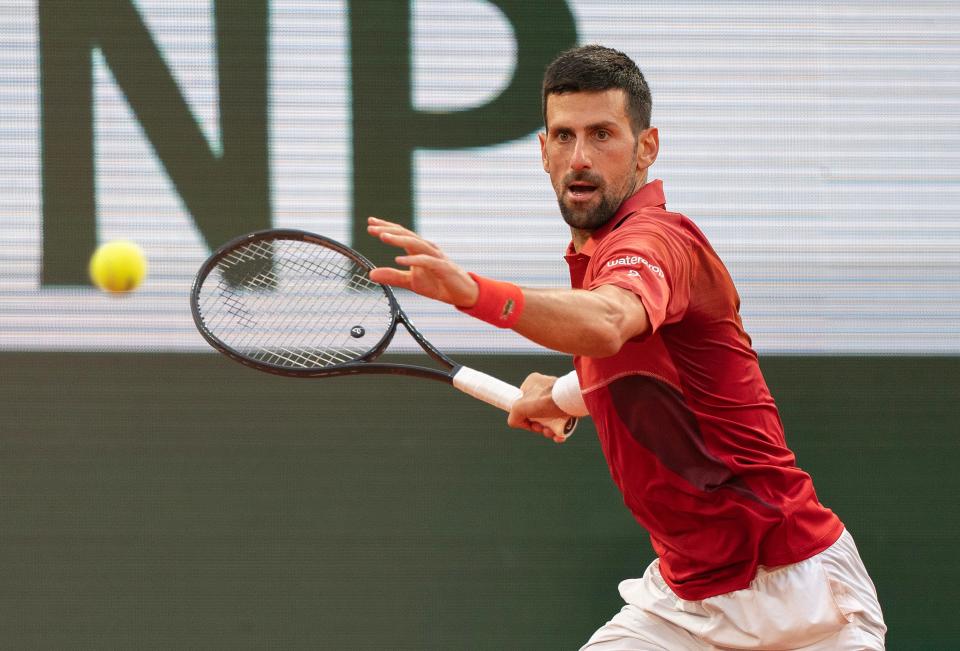 Novak Djokovic returns a shot during his match against Francisco Cerundolo on Day 9 at Roland Garros.