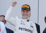 Formula One - F1 - Russian Grand Prix - Sochi, Russia - 30/04/17 - Mercedes Formula One driver Valtteri Bottas of Finland celebrates the victory on the podium. REUTERS/Maxim Shemetov