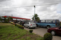 Venezuelan motorists line up for fuel at a gas station of Venezuelan state oil company PDVSA in Maturin, Venezuela March 23, 2017. REUTERS/Marco Bello