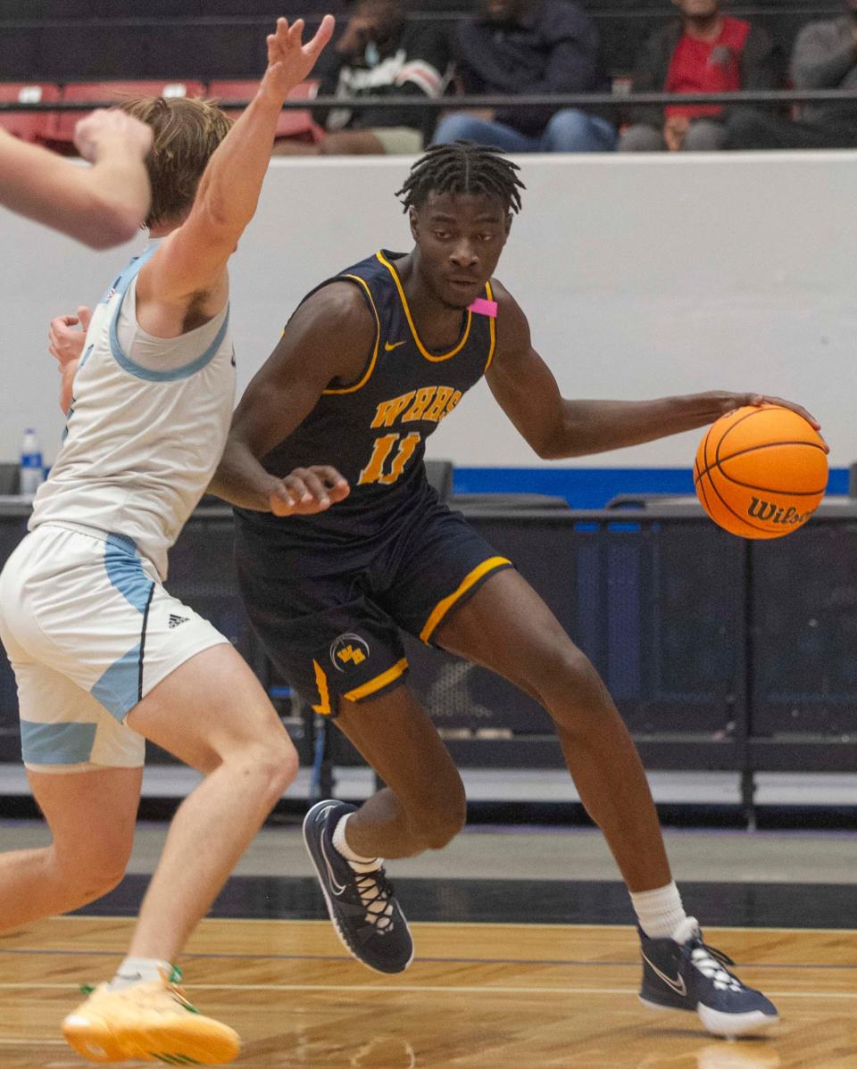 Winter Haven High School's Dylan James (11) drives towards the basket against Ponte Vedra during the second half of their FHSAA Class 6A state semifinal game on Thursday at the RP Funding Center in Lakeland.