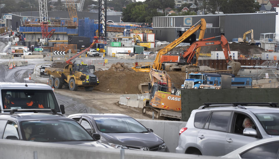 Heavy machinery work on a major road project in Sydney, Australia, Tuesday, May 11, 2021. The Australian government will release its big-spending economic plan for the next fiscal year on Tuesday designed to create jobs and repair pandemic damage and with an eye toward winning votes at looming general elections. (AP Photo/Mark Baker)