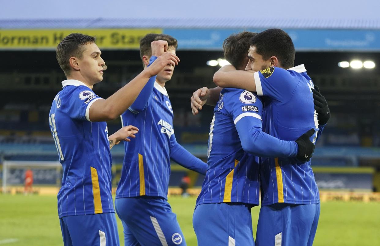 Brighton celebrate their early goal by Neal Maupay (AP)