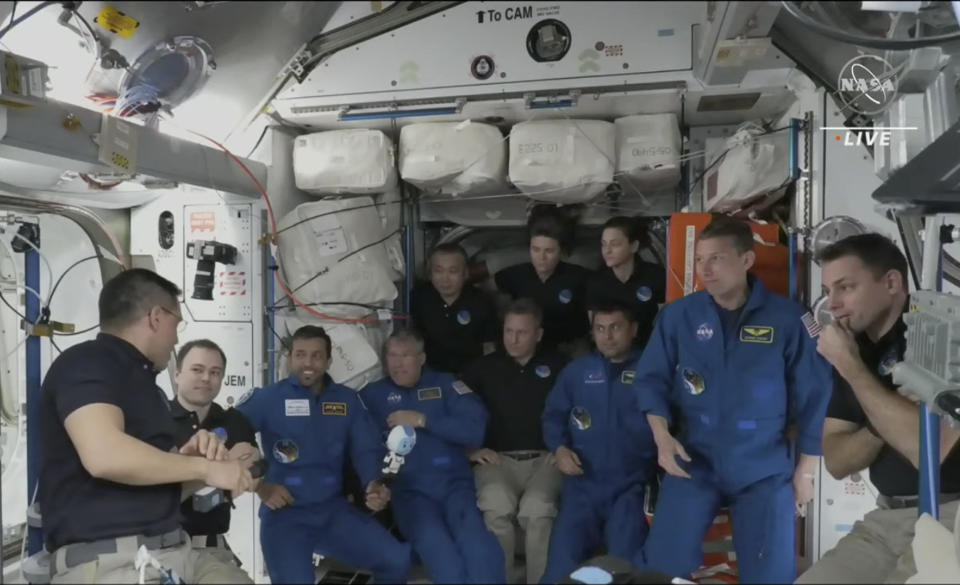 In this image from NASA TV, the four astronauts including United Arab Emirates' Sultan al-Neyadi, third left gather, during the welcoming ceremony, on the International Space Station, Friday, March 3, 2023. A new crew from the United States, Russia and United Arab Emirates has arrived at the International Space Station. The new arrivals include United Arab Emirates' Sultan al-Neyadi, the first astronaut from the Arab world who will spend an extended time in space. Al-Neyadi is only the second person from the UAE to rocket into orbit. (NASA TV via AP)